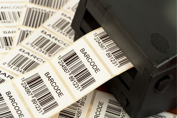 A Zebra barcode printer printing multiple labels
